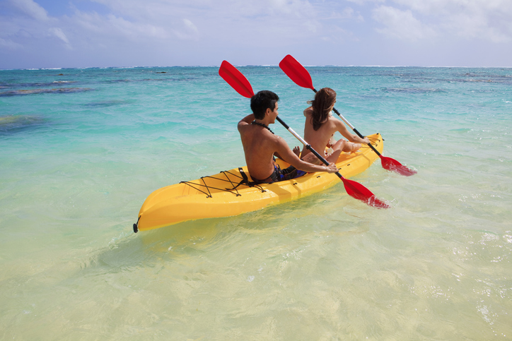 A couple kayaking on the blue waters